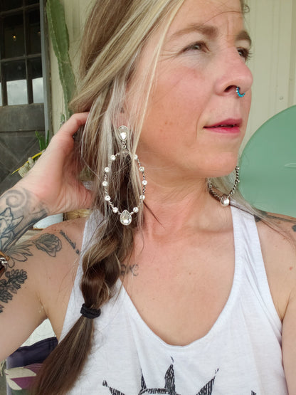 The "Sit with Us" post earrings