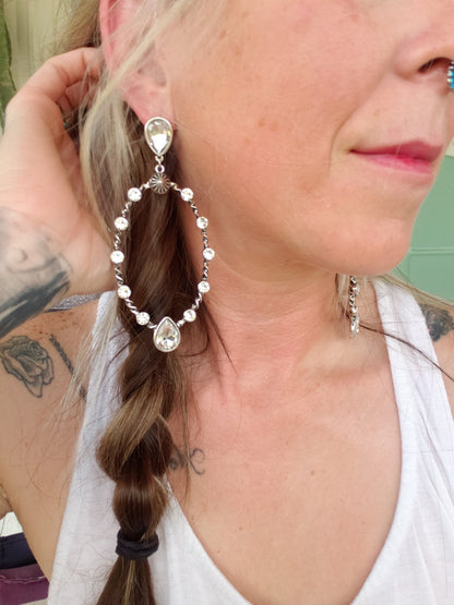 The "Sit with Us" post earrings